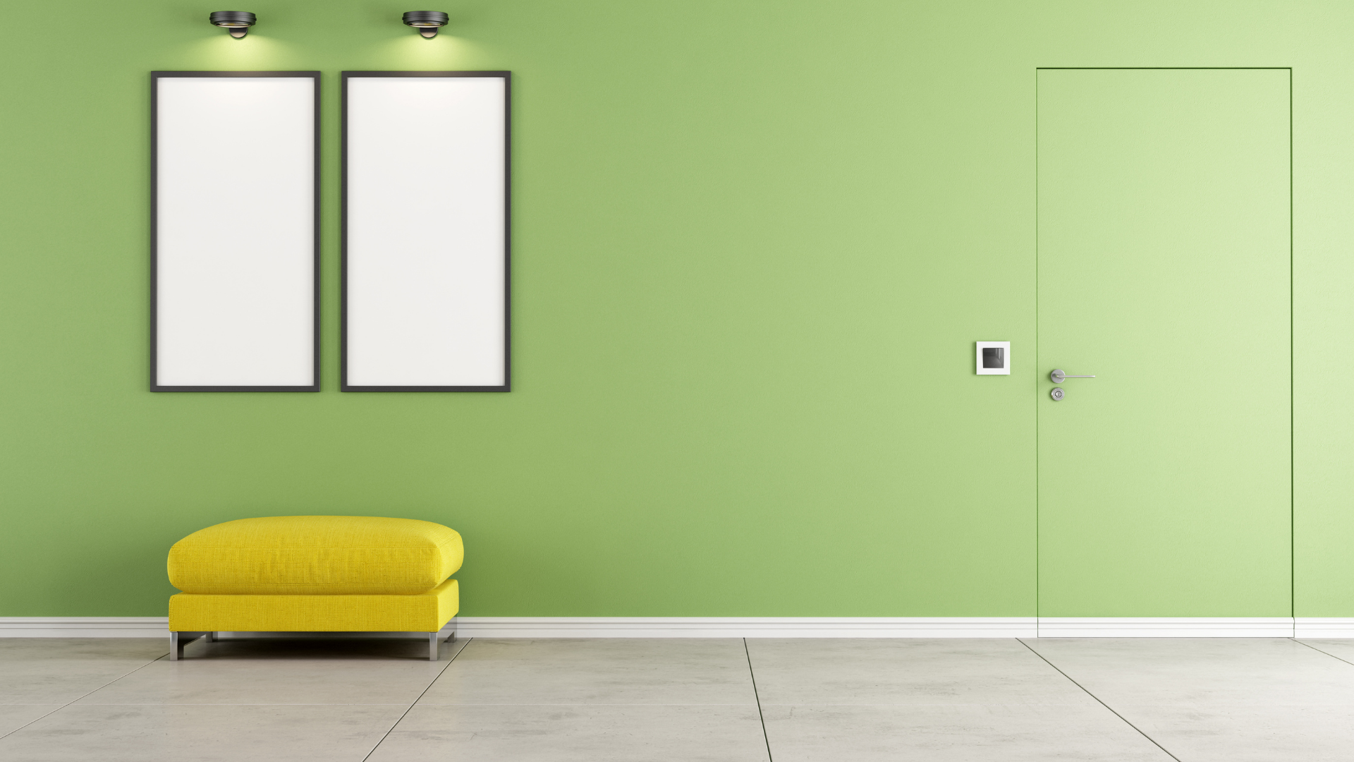light green room with yellow ottoman and two white frames on the wall